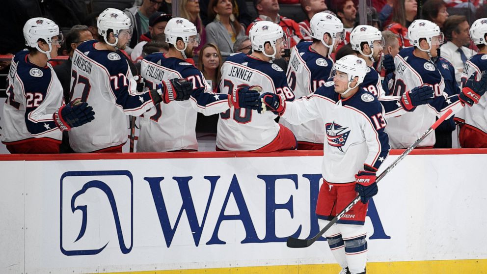 Columbus Blue Jackets right wing Cam Atkinson (13) celebrates his goal during the first period of an NHL hockey game against the Washington Capitals, Monday, Dec. 9, 2019, in Washington. (AP Photo/Nick Wass)