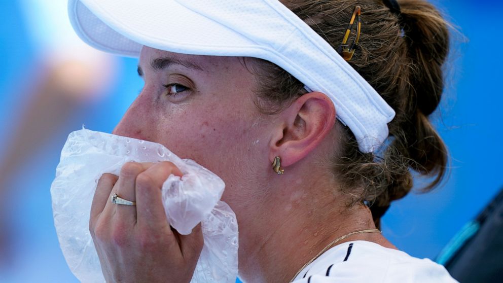Elise Mertens, of Belgium, uses a bag of ice to cool off during a tennis†match against Ekaterina Aleksandrova, of the Russian Olympic Committee, at the 2020 Summer Olympics, Sunday, July 25, 2021, in Tokyo, Japan. (AP Photo/Patrick Semansky)