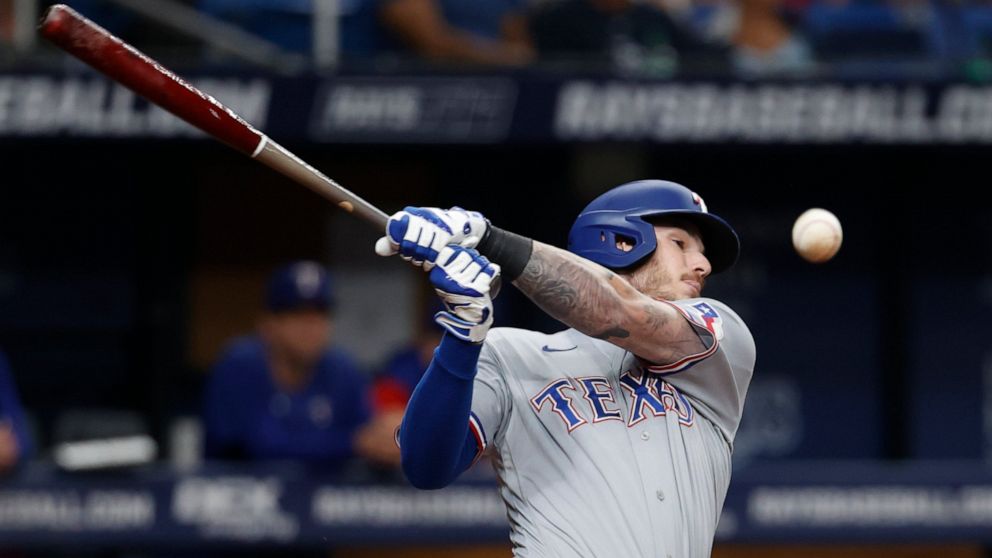 Texas Rangers' Jonah Heim fouls off a Tampa Bay Rays pitch during the fifth inning of a baseball game Friday, Sept. 16, 2022, in St. Petersburg, Fla. (AP Photo/Scott Audette)