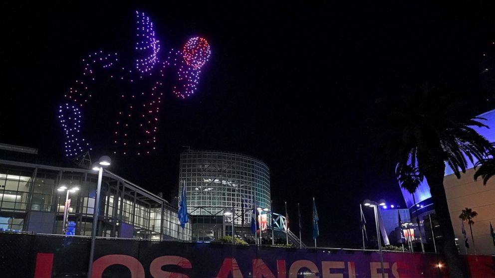 Five hundred drones form the shape of a football player and fly over the Los Angeles Convention Center during the Super Bowl LVI Drone Show Friday night, Feb. 11, 2022. The Rams are scheduled to play the Cincinnati Bengals in the Super Bowl on Sunday