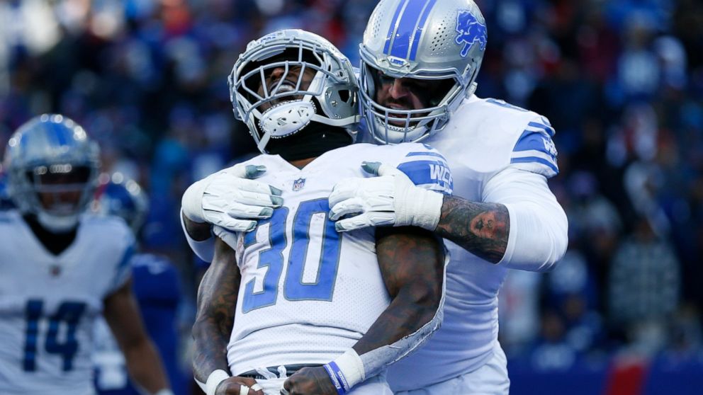 Detroit Lions running back Jamaal Williams (30) celebrates after scoring a touchdown during the first half of an NFL football game against the New York Giants, Sunday, Nov. 20, 2022, in East Rutherford, N.J. (AP Photo/John Munson)
