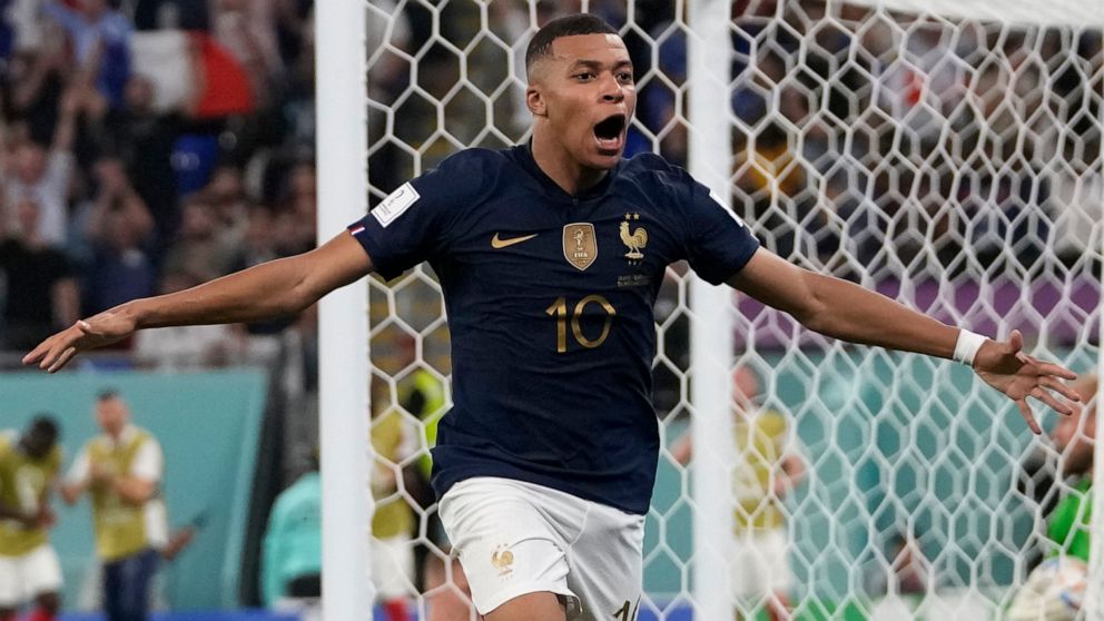 France's Kylian Mbappe celebrates after scoring his sides second goal during the World Cup group D soccer match between France and Denmark, at the Stadium 974 in Doha, Qatar, Saturday, Nov. 26, 2022. (AP Photo/Thanassis Stavrakis)