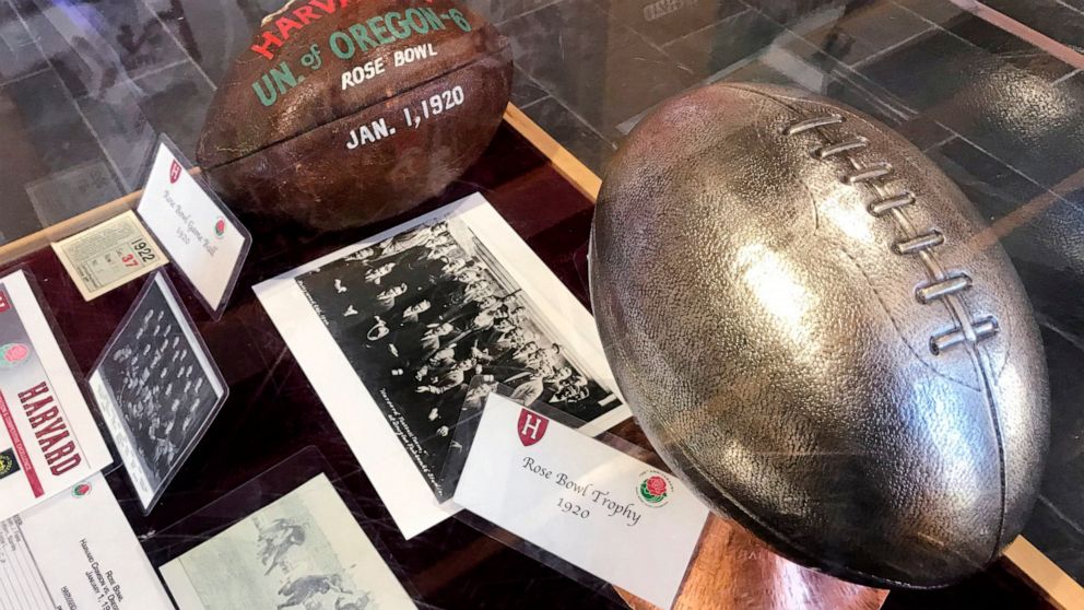 A selection memorabilia from the 1920 Harvard University football season, including a dated leather football, a team photo and trophy, are displayed at the school's athletic complex in Cambridge, Mass., Friday Nov. 1, 2019. Harvard's 7-6 victory over