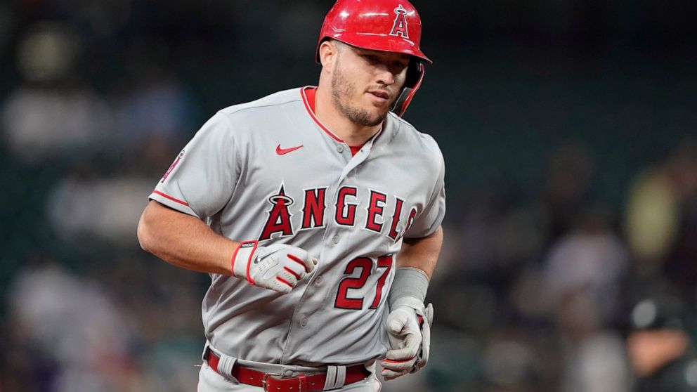 Los Angeles Angels' Mike Trout runs the bases after he hit a two-run home run against the Seattle Mariners during the seventh inning of a baseball game Thursday, June 16, 2022, in Seattle. The homer was Trout's second of the night. (AP Photo/Ted S. W