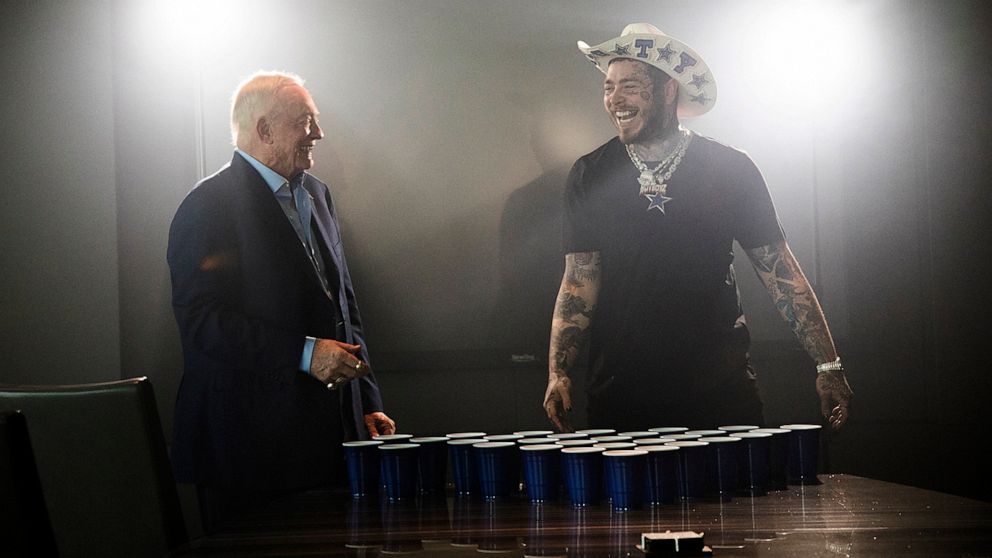 Dallas Cowboys owner Jerry Jones, left, and singer/rapper Post Malone take a break between takes for the 2021 Dallas Cowboys schedule release video at The Star in Frisco, Texas on Friday, April 8, 2021. Schedule release day has become a competition a