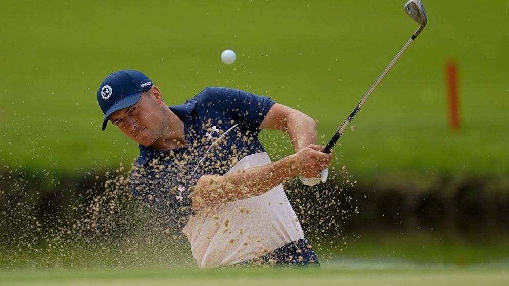 Jordan Spieth hits from the bunker on the 13th hole during a practice round for the PGA Championship golf tournament, Tuesday, May 17, 2022, in Tulsa, Okla. (AP Photo/Sue Ogrocki)
