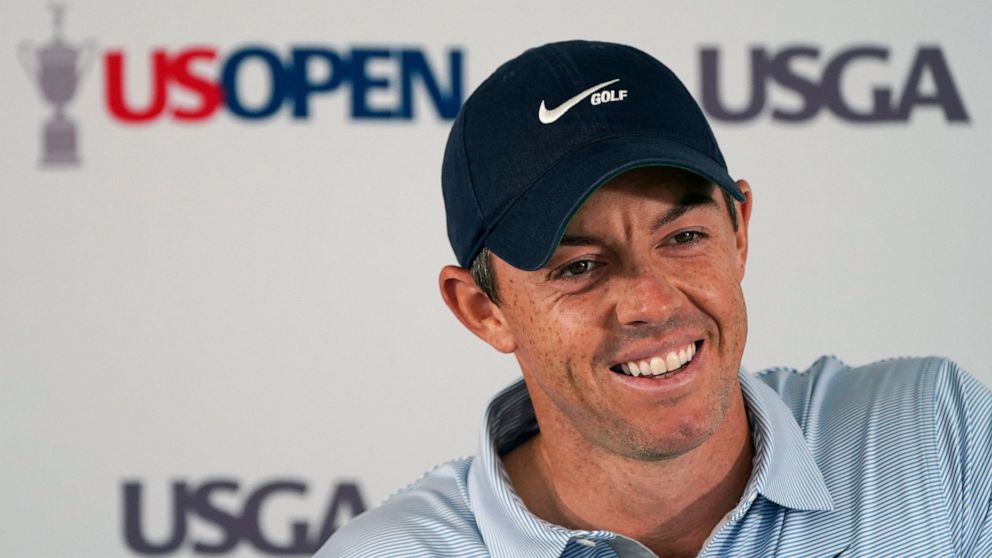 Rory McIlroy, of Northern Ireland, smiles while answering a question during a media availability ahead of the U.S. Open golf tournament, Tuesday, June 14, 2022, at The Country Club in Brookline, Mass. (AP Photo/Charles Krupa)
