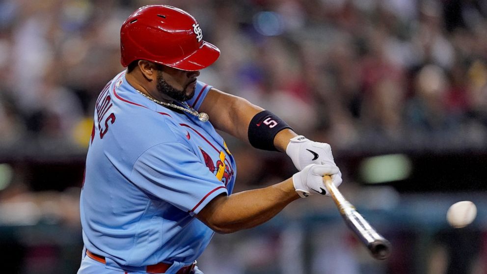 St. Louis Cardinals' Albert Pujols connects for a solo home run during the fourth inning of a baseball game against the Arizona Diamondbacks, Saturday, Aug. 20, 2022, in Phoenix. (AP Photo/Matt York)