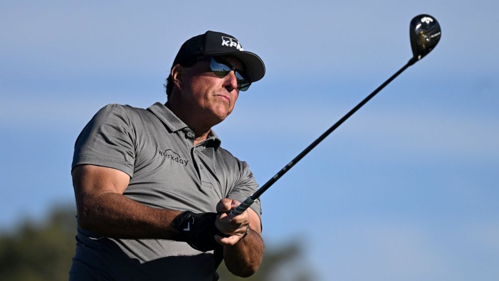 FILE - Phil Mickelson hits his tee shot on the fifth hole of the South Course at Torrey Pines during the first round of the Farmers Insurance Open golf tournament, Jan. 26, 2022, in San Diego. Phil Mickelson, the chief recruiter for a Saudi-funded ri