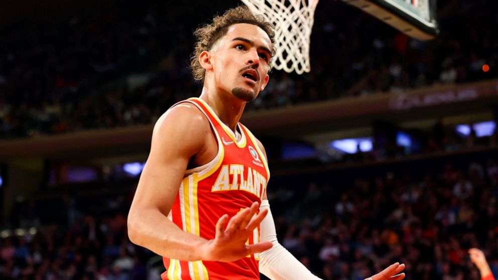 Atlanta Hawks guard Trae Young (11) motions to the crowd during the first half of an NBA basketball game against the New York Knicks, Tuesday, March 22, 2022, in New York. (AP Photo/Jessie Alcheh)