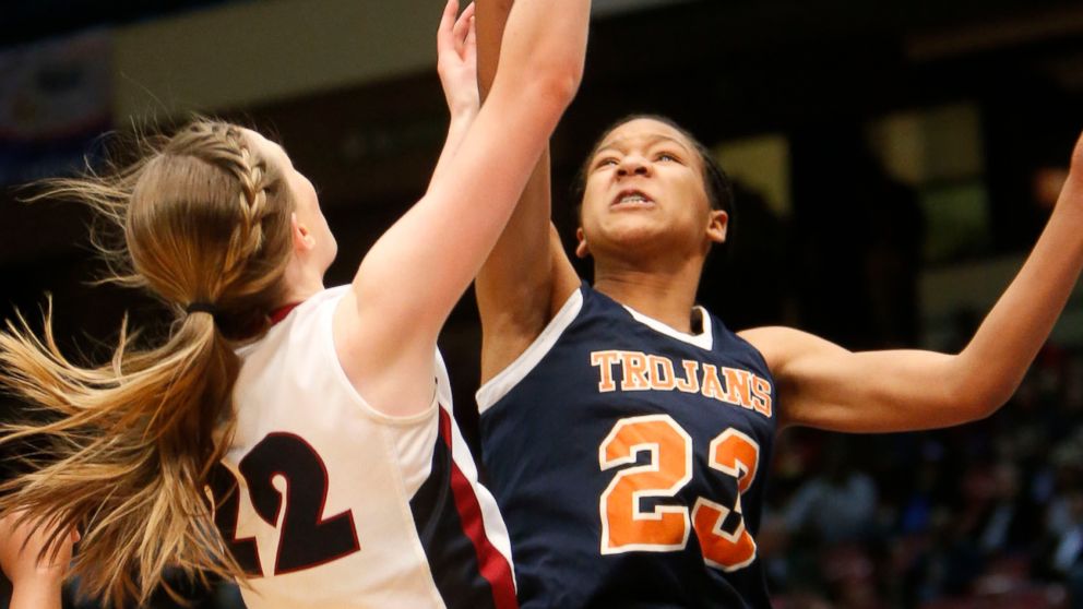 FILE - In this Feb. 26, 2014, file photo, Oneonta's Abby Blackwood, left, shoots over Charles Henderson's Maori Davenport in a girls' Class 4A state basketball semifinal, in Birmingham, Ala. An Alabama judge has temporarily reinstated the eligibility