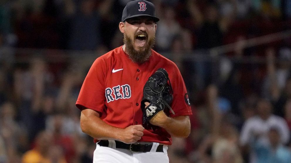 Boston Red Sox relief pitcher John Schreiber reacts after getting the final out against the Baltimore Orioles in a baseball game at Fenway Park, Thursday, Aug. 11, 2022, in Boston. (AP Photo/Mary Schwalm)