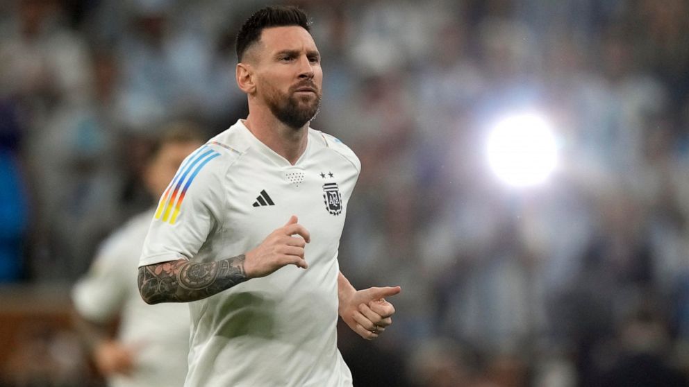 Argentina's Lionel Messi warms up for the World Cup final soccer match between Argentina and France at the Lusail Stadium in Lusail, Qatar, Sunday, Dec. 18, 2022. (AP Photo/Frank Augstein)