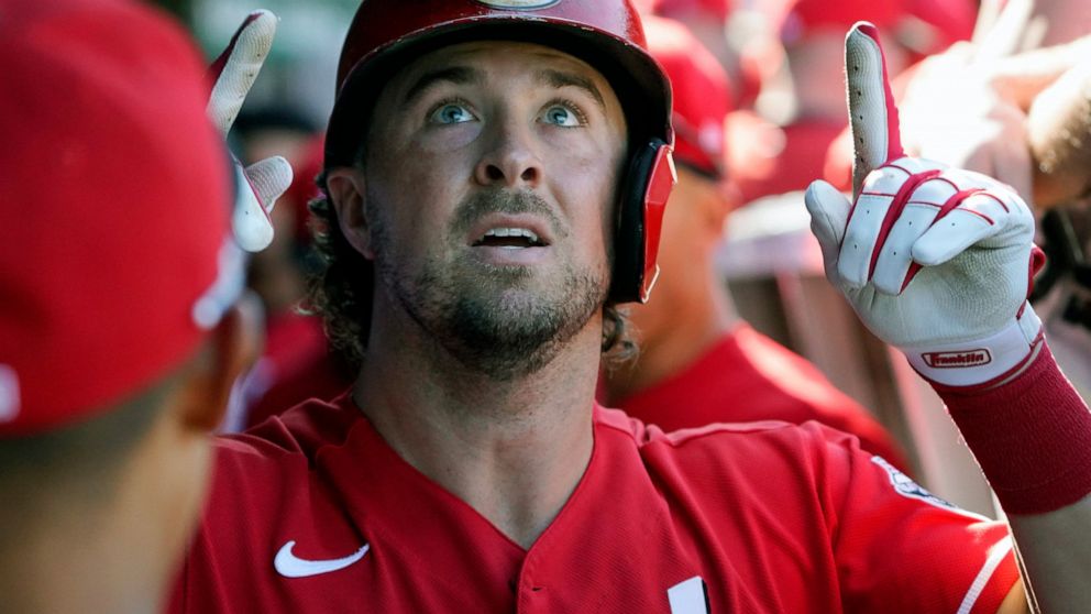 Cincinnati Reds' Kyle Farmer (17) gestures in the dugout after hitting a home run against the Chicago Cubs during the seventh inning of a baseball game, Thursday, Sept. 8, 2022, in Chicago. (AP Photo/David Banks)