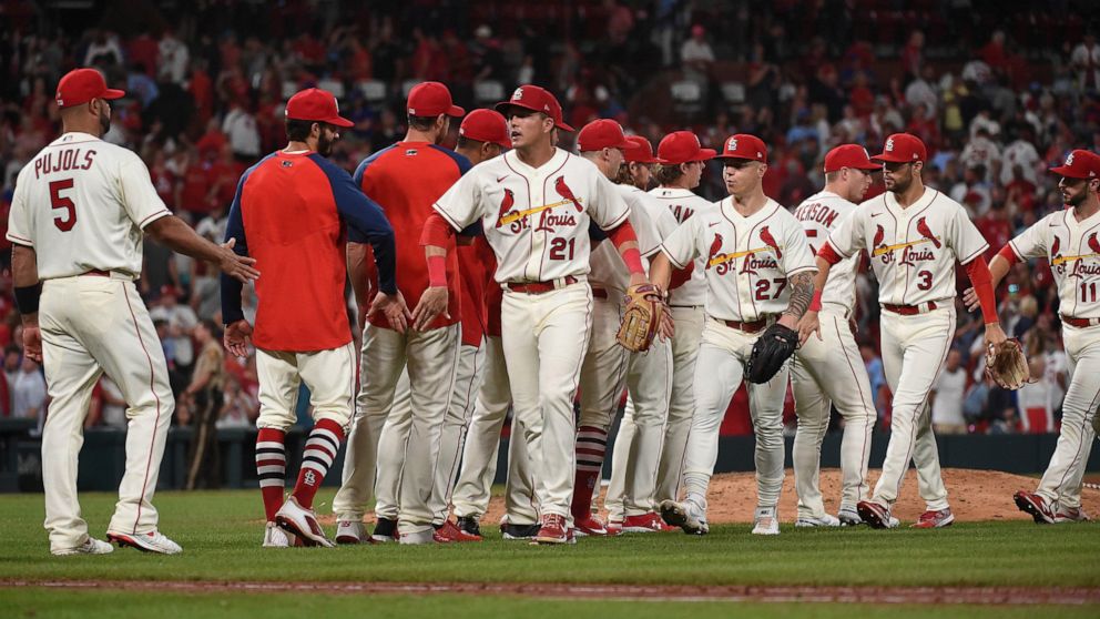 St. Louis Cardinals celebrate their team's 8-4 victory in a baseball game against the Chicago Cubs on Saturday, Sept. 3, 2022, in St. Louis. (AP Photo/Joe Puetz)