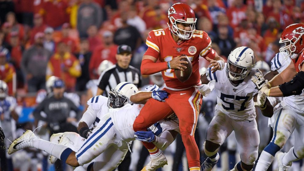 Kansas City Chiefs quarterback Patrick Mahomes (15) is tackled by Indianapolis Colts defensive end Jabaal Sheard (93) and defensive end Kemoko Turay (57) during the second half of an NFL football game in Kansas City, Mo., Sunday, Oct. 6, 2019. (AP Ph
