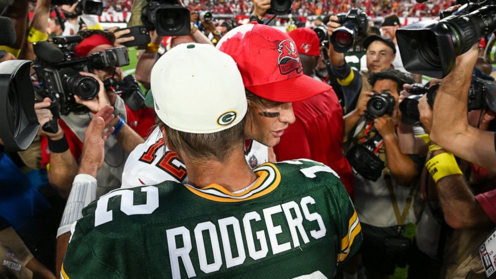 Green Bay Packers' Aaron Rodgers hugs Tampa Bay Buccaneers' Tom Brady after an NFL football game Sunday, Sept. 25, 2022, in Tampa, Fla. The Packers won 14-12. (AP Photo/Jason Behnken)