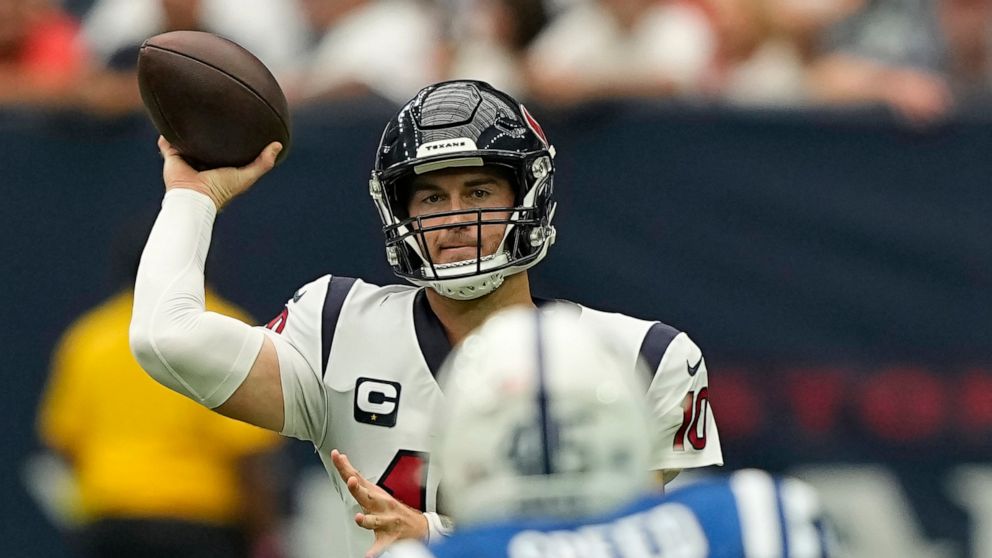 Houston Texans quarterback Davis Mills (10) takes a toss during the second half of an NFL football game Sunday, Sept. 11, 2022, in Houston. (AP Photo/David J. Phillip)