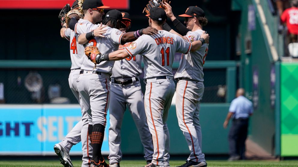 Members of the Baltimore Orioles celebrate a 3-2 victory over the St. Louis Cardinals in a baseball game Thursday, May 12, 2022, in St. Louis. (AP Photo/Jeff Roberson)