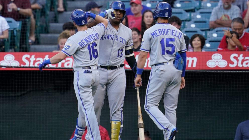 Kansas City Royals' Andrew Benintendi (16) greets Salvador Perez (13) after hitting a home run during the first inning of a baseball game against the Los Angeles Angels in Anaheim, Calif., Monday, June 20, 2022. Whit Merrifield (15) also scored. (AP 