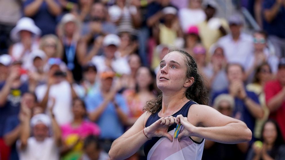 Daria Snigur, of Ukraine, reacts after upsetting Simona Halep, of Romania, during the first round of the US Open tennis championships, Monday, Aug. 29, 2022, in New York. (AP Photo/Seth Wenig)
