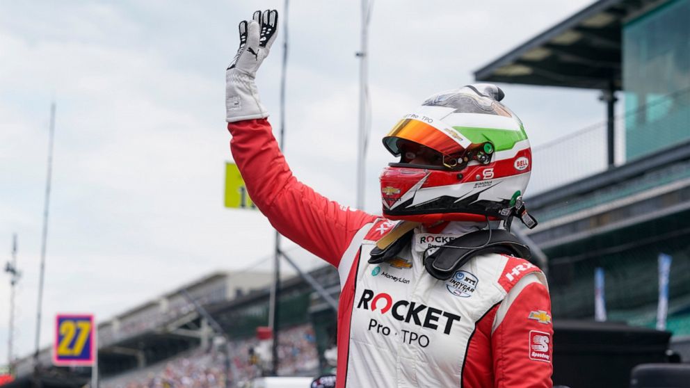 FILE - Simona de Silvestro, of Switzerland, waves to fans during qualifications for the Indianapolis 500 auto race at Indianapolis Motor Speedway on May 23, 2021, in Indianapolis. de Silvestro will make her IndyCar season debut Sunday, June 12, 2022,
