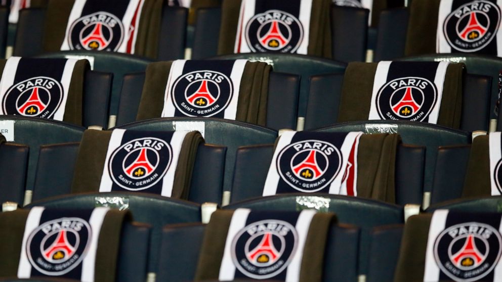 FILE - The logos of the Paris Saint Germain are displayed on the seats of the VIP stands prior to the Champion's League round of 16, first leg soccer match between Paris Saint Germain and Barcelona at the Parc des Princes stadium in Paris, Tuesday, F