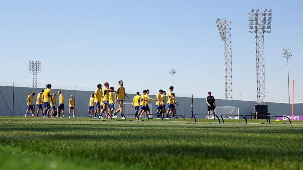 Players warm up during Japan official training on the eve of the group E of World Cup soccer match between Japan and Costa Rica, in Doha, Qatar, Saturday, Nov. 26, 2022. (AP Photo/Eugene Hoshiko)