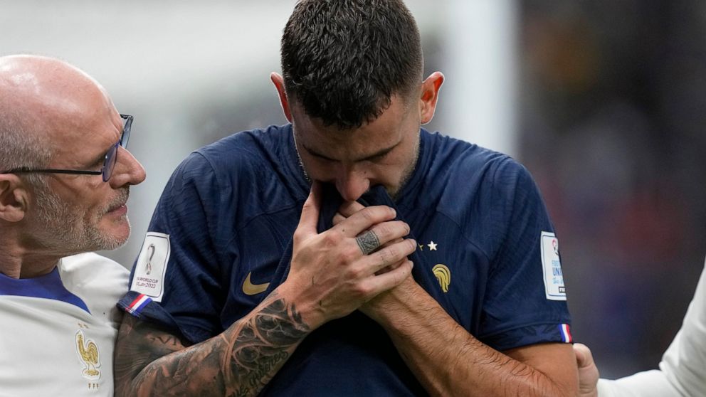 France's Lucas Hernandez leaves the pitch after getting injured during the World Cup group D soccer match between France and Australia, at the Al Janoub Stadium in Al Wakrah, Qatar, Tuesday, Nov. 22, 2022. (AP Photo/Thanassis Stavrakis)