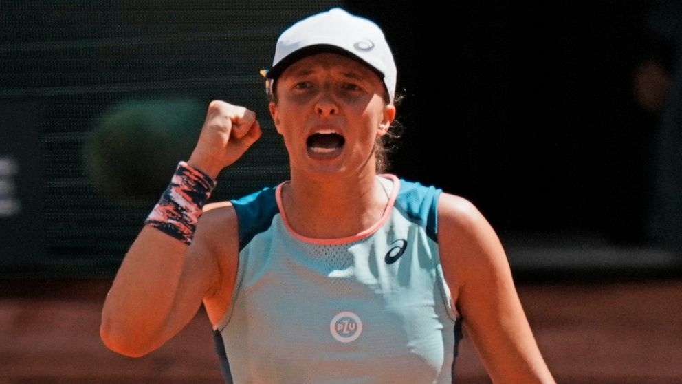 Poland's Iga Swiatek clenches her fist after defeating Jessica Pegula of the U.S. during their quarterfinal match of the French Open tennis tournament at the Roland Garros stadium Wednesday, June 1, 2022 in Paris. Swiatek won 6-3, 6-2. (AP Photo/Thib