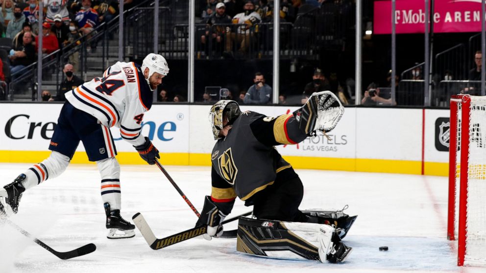 Edmonton Oilers right wing Zack Kassian (44) scores past Vegas Golden Knights goaltender Robin Lehner (90) during the third period of an NHL hockey game Friday, Oct. 22, 2021, in Las Vegas. (AP Photo/Steve Marcus)