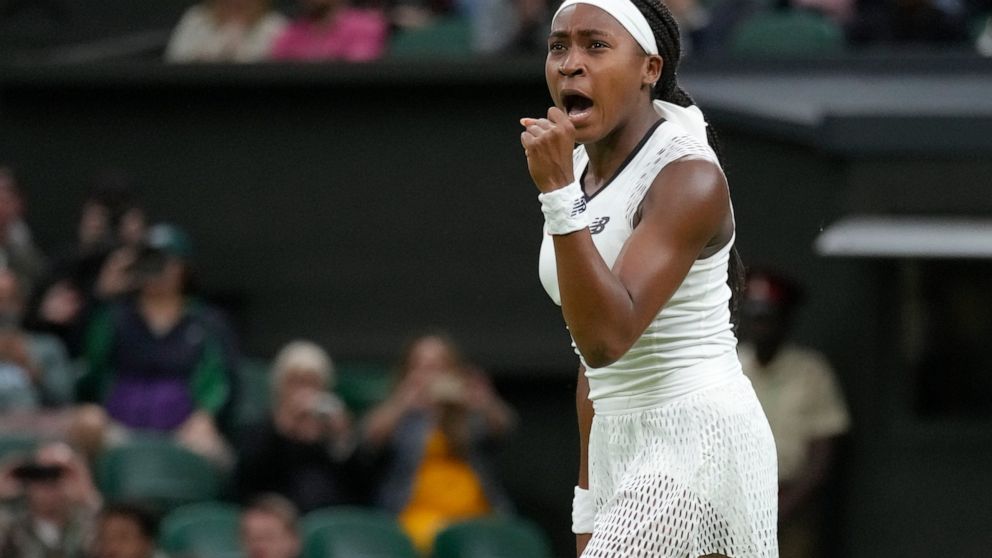 Coco Gauff of the US celebrates after beating Romania's Mihaela Buzarnescu in a second round women's singles match on day four of the Wimbledon tennis championships in London, Thursday, June 30, 2022. (AP Photo/Kirsty Wigglesworth)