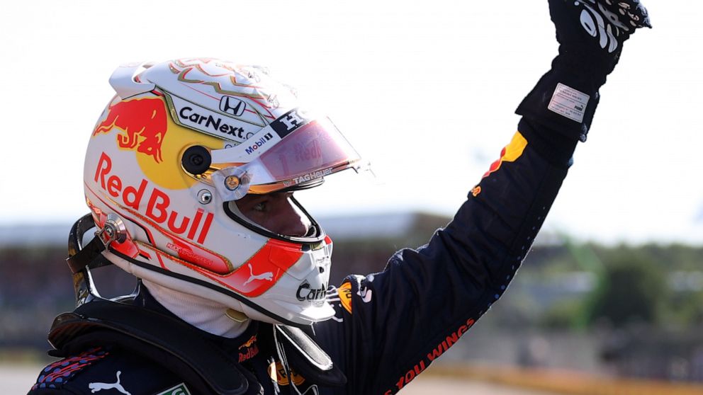 Red Bull driver Max Verstappen of the Netherlands waves to fans after finishing first in the Sprint Qualifying of the British Formula One Grand Prix, at the Silverstone circuit, in Silverstone, England, Saturday, July 17, 2021. The British Formula On