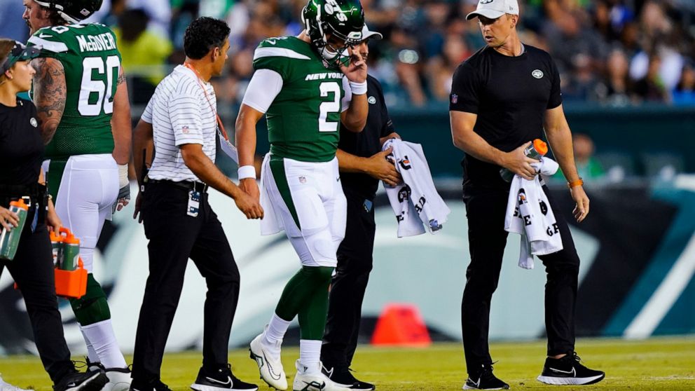 New York Jets' Zach Wilson is taken off the field after an injury during the first half of a preseason NFL football game against the Philadelphia Eagles on Friday, Aug. 12, 2022, in Philadelphia. (AP Photo/Matt Rourke)