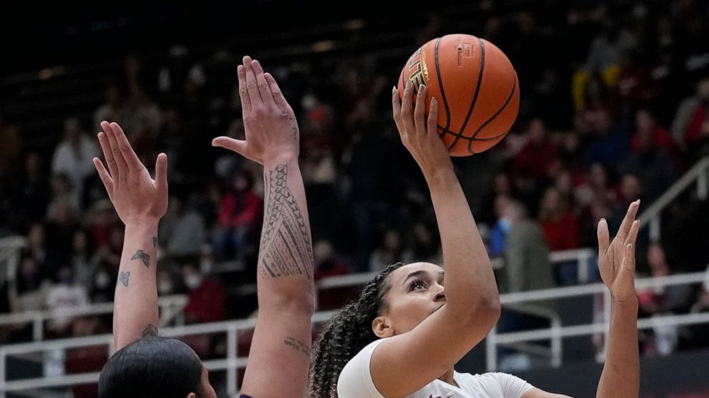 Stanford guard Haley Jones shoots next to California forward Peanut Tuitele during the first half of an NCAA college basketball game in Stanford, Calif., Friday, Dec. 23, 2022. (AP Photo/Godofredo A. Vásquez)
