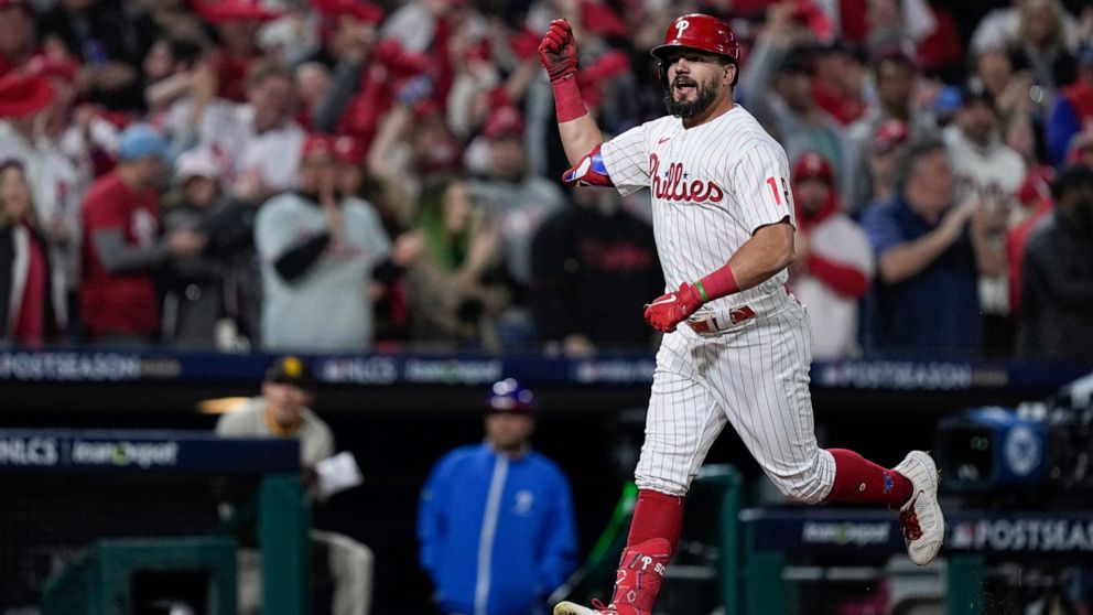 Philadelphia Phillies' Kyle Schwarber celebrates his home run during the sixth inning in Game 4 of the baseball NL Championship Series between the San Diego Padres and the Philadelphia Phillies on Saturday, Oct. 22, 2022, in Philadelphia. (AP Photo/M