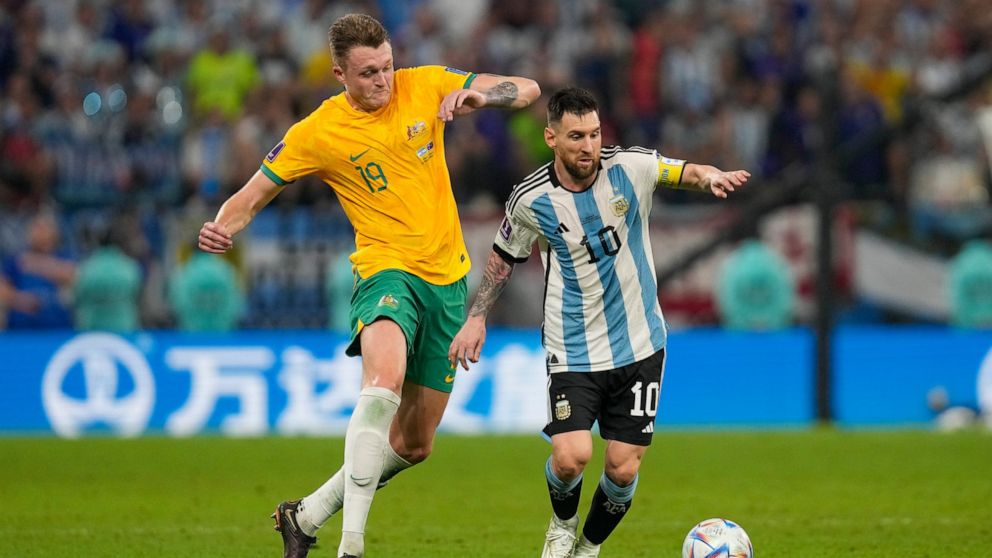 Australia's Harry Souttar chases Argentina's Lionel Messi during the World Cup round of 16 soccer match between Argentina and Australia at the Ahmad Bin Ali Stadium in Doha, Qatar, Saturday, Dec. 3, 2022. (AP Photo/Thanassis Stavrakis)