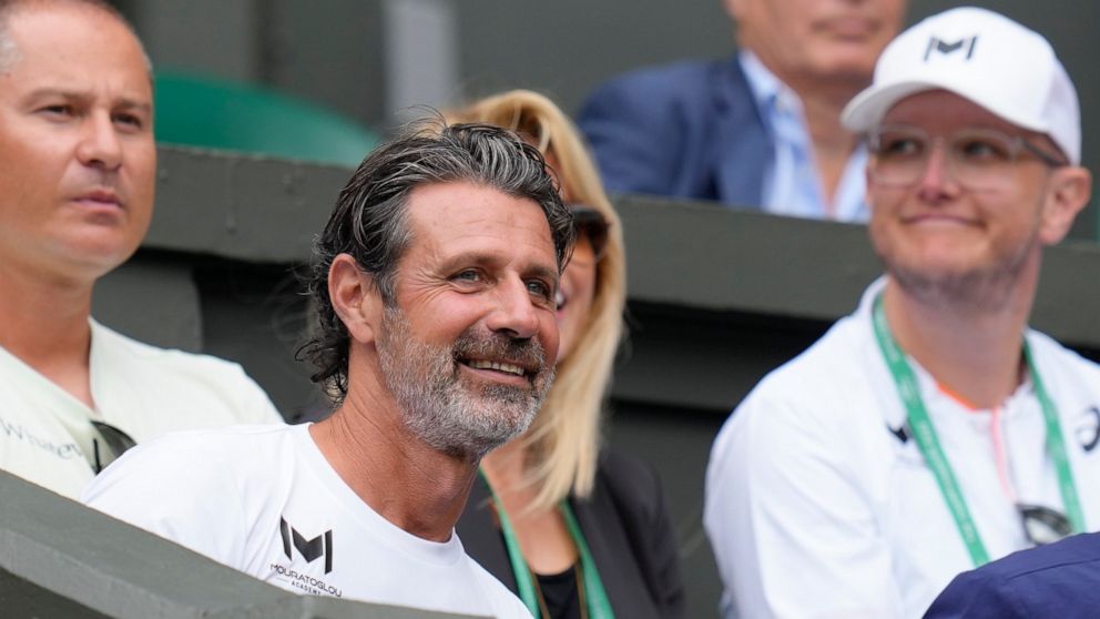 Patrick Mouratoglou, the coach of Romania's Simona Halep sits in the players box for her match against Amanda Anisimova of the US in the women's singles quarterfinals on day ten of the Wimbledon tennis championships in London, Wednesday, July 6, 2022