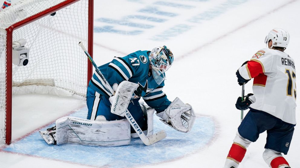 Florida Panthers center Sam Reinhart, right, scores the winning goal against San Jose Sharks goaltender James Reimer (47) during the shootout of an NHL hockey game in San Jose, Calif., Thursday, Nov. 3, 2022. (AP Photo/Godofredo A. Vásquez)
