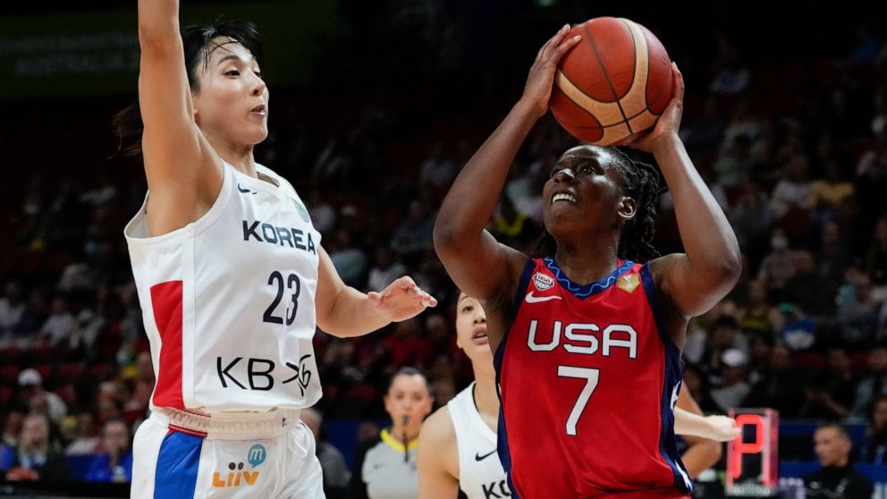United States' Ariel Atkins shoots at goal as South Korea's Kim Danbi , left, attempts to block during their game at the women's Basketball World Cup in Sydney, Australia, Monday, Sept. 26, 2022. (AP Photo/Mark Baker)