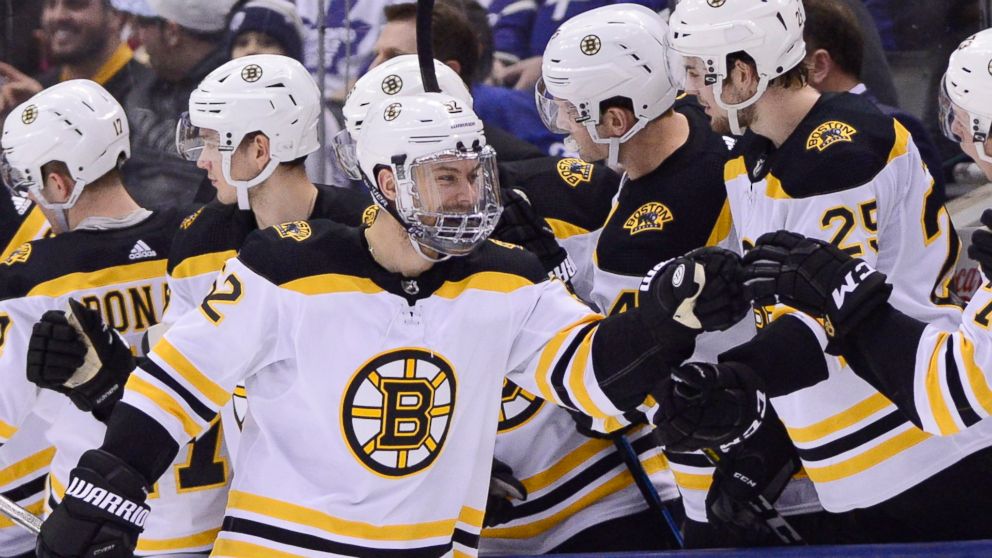 Boston Bruins center Sean Kuraly (52) skates over to the bench to celebrate his goal against the Toronto Maple Leafs during the second period of an NHL hockey game, Saturday, Jan. 12, 2019 in Toronto. (Frank Gunn/The Canadian Press via AP)