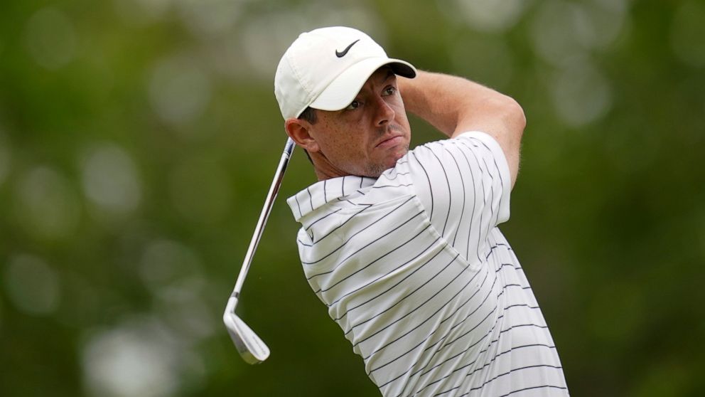 Rory McIlroy, of North Ireland, watches his tee shot during a practice round for the PGA Championship golf tournament, Tuesday, May 17, 2022, in Tulsa, Okla. (AP Photo/Sue Ogrocki)