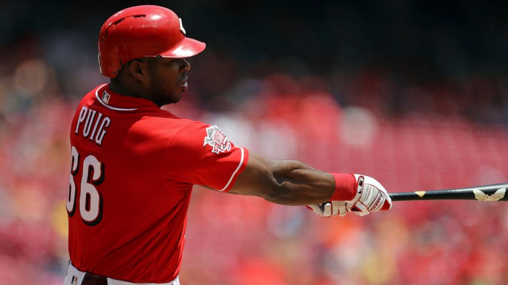 Cincinnati Reds' Yasiel Puig hits a solo home run in the second inning of a baseball game against the Houston Astros, Wednesday, June 19, 2019, in Cincinnati. (AP Photo/Aaron Doster)