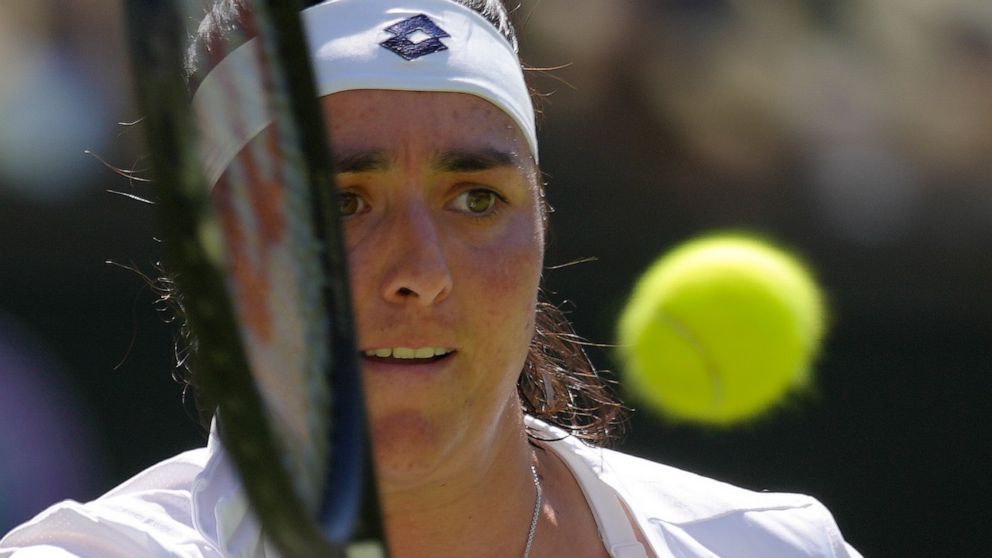 Tunisia's Ons Jabeur returns to Kazakhstan's Elena Rybakina in the final of the women's singles on day thirteen of the Wimbledon tennis championships in London, Saturday, July 9, 2022. (AP Photo/Kirsty Wigglesworth)