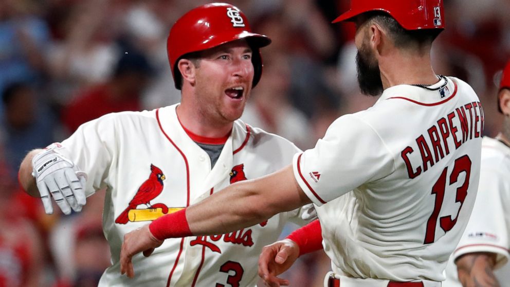 St. Louis Cardinals' Jedd Gyorko (3) is congratulated by teammate Matt Carpenter (13) after hitting a three-run home run during the eighth inning of a baseball game against the Atlanta Braves, Saturday, May 25, 2019, in St. Louis. (AP Photo/Jeff Roberson)