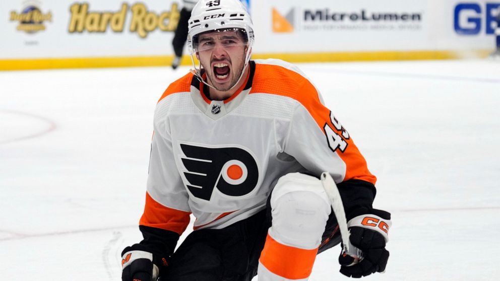 Philadelphia Flyers left wing Noah Cates (49) celebrates his goal against the Tampa Bay Lightning during the third period of an NHL hockey game Tuesday, Oct. 18, 2022, in Tampa, Fla. (AP Photo/Chris O'Meara)