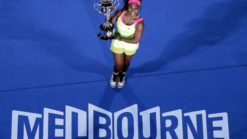 FILE - Serena Williams of the U.S. holds the trophy after defeating Maria Sharapova of Russia in the women's singles final at the Australian Open tennis championship in Melbourne, Australia, Saturday, Jan. 31, 2015. Saying “the countdown has begun,” 