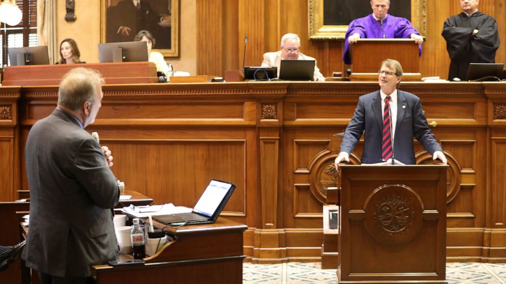 South Carolina Sen. Brad Hutto, D-Orangeburg, left, asks questions to Sen. Richard Cash, R-Powdersville, right, during a debate over transgender athletes playing sports on Tuesday, May 3, 2022, in Columbia, S.C. (AP Photo/Jeffrey Collins)