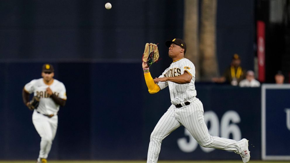 San Diego Padres right fielder Juan Soto makes the catch for the out on Colorado Rockies' Brendan Rodgers during the sixth inning of a baseball game Wednesday, Aug. 3, 2022, in San Diego. (AP Photo/Gregory Bull)