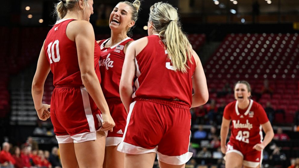 Nebraska's Jaz Shelley, center, reacts after scoring and drawing the foul against Maryland in the second half of an NCAA college basketball game, Sunday, Dec. 4, 2022, in College Park, Md. Nebraska won 90-67. (AP Photo/Gail Burton)